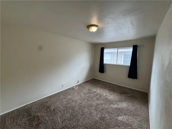 an empty room with a empty space and window