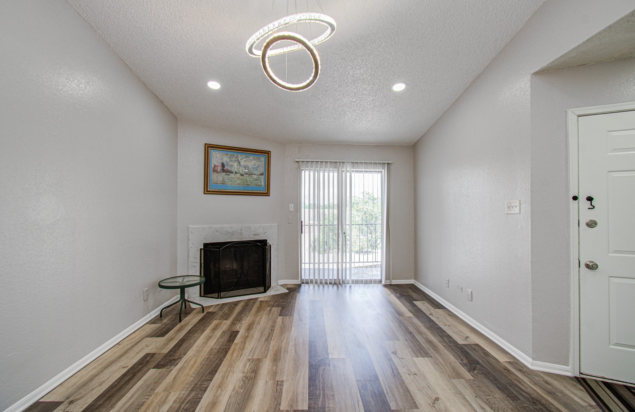 10101 South Gessner Road, Unit 405 Houston, TX 77071 - Photo 8 of 27 a view of a livingroom with wooden floor and window