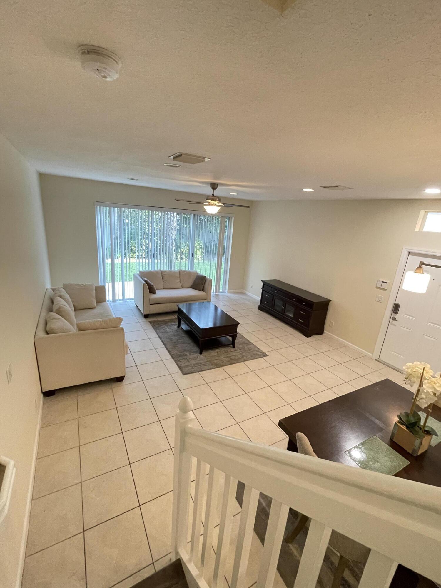 1021 Woodfield Road Greenacres, FL 33415 - Photo 12 of 32 STAIRS TO LIVING ROOM