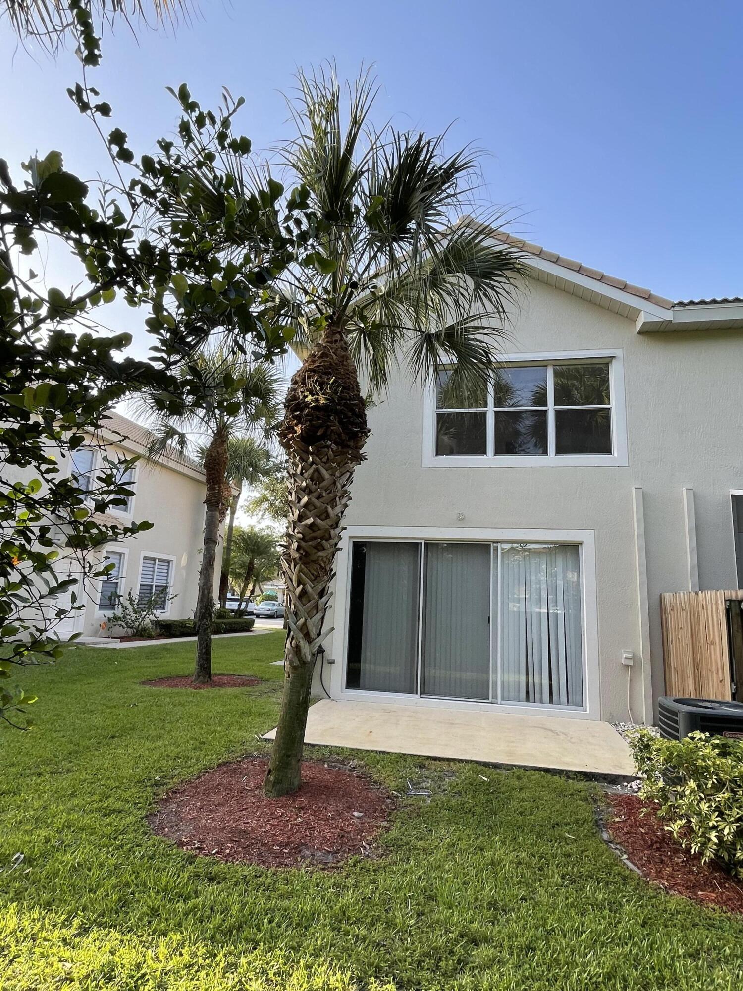 1021 Woodfield Road Greenacres, FL 33415 - Photo 3 of 32 BACK END