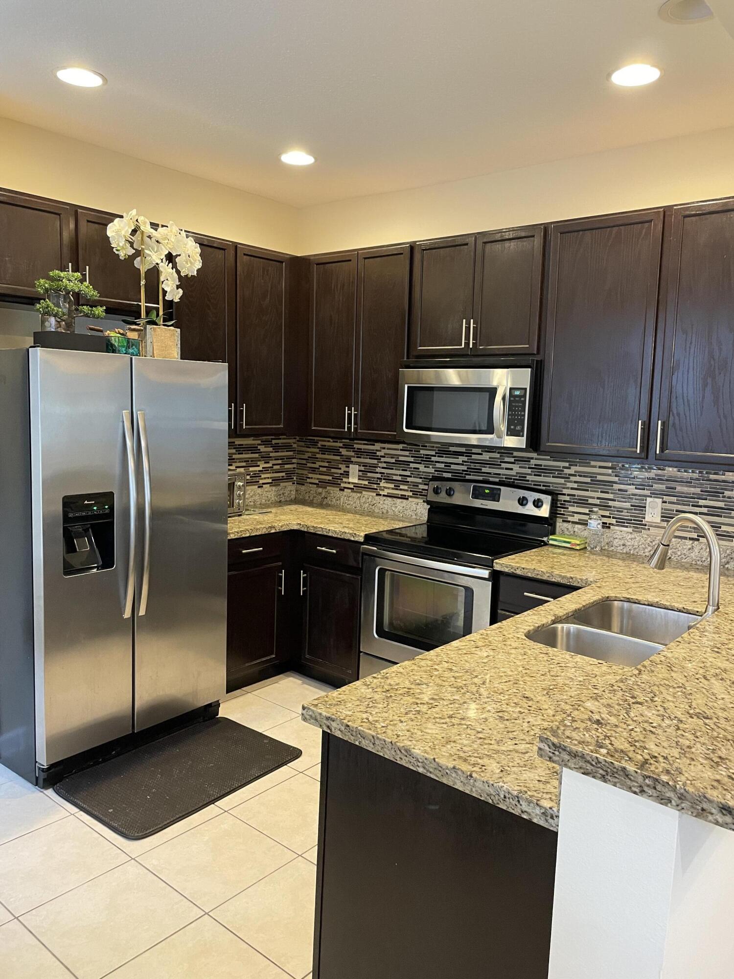 1021 Woodfield Road Greenacres, FL 33415 - Photo 7 of 32 KITCHEN