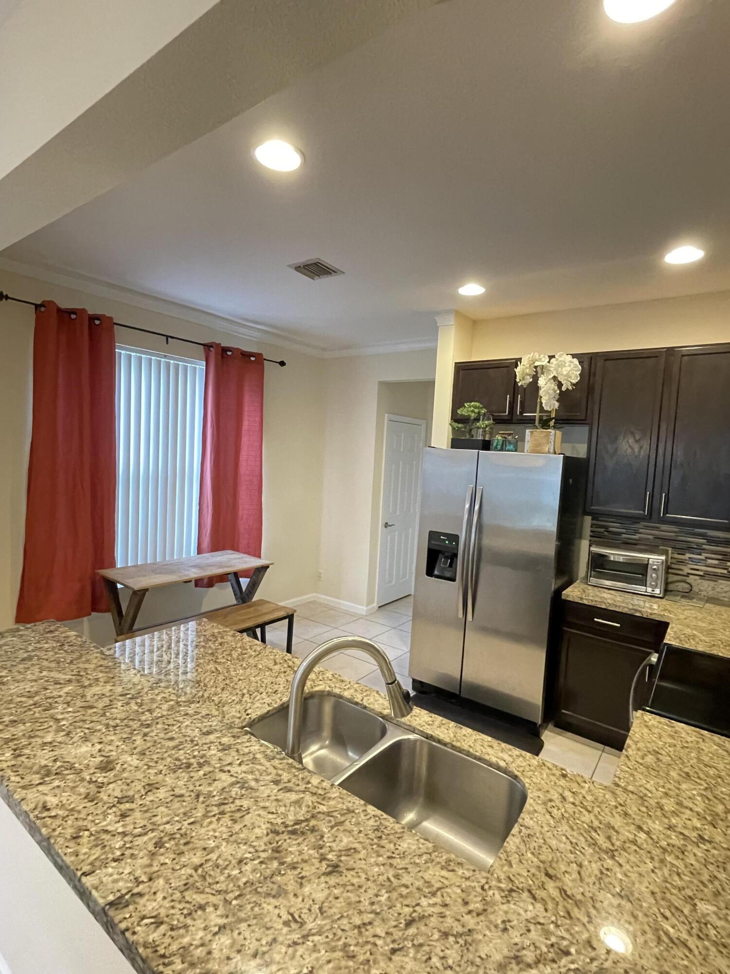 1021 Woodfield Road Greenacres, FL 33415 - Photo 8 of 32 KITCHEN