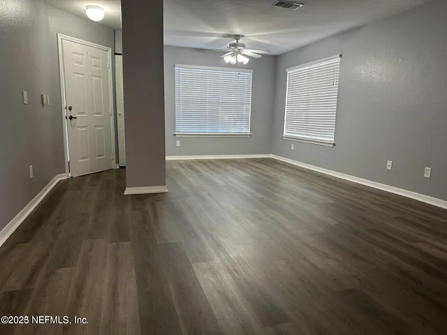 a view of kitchen with wooden floor