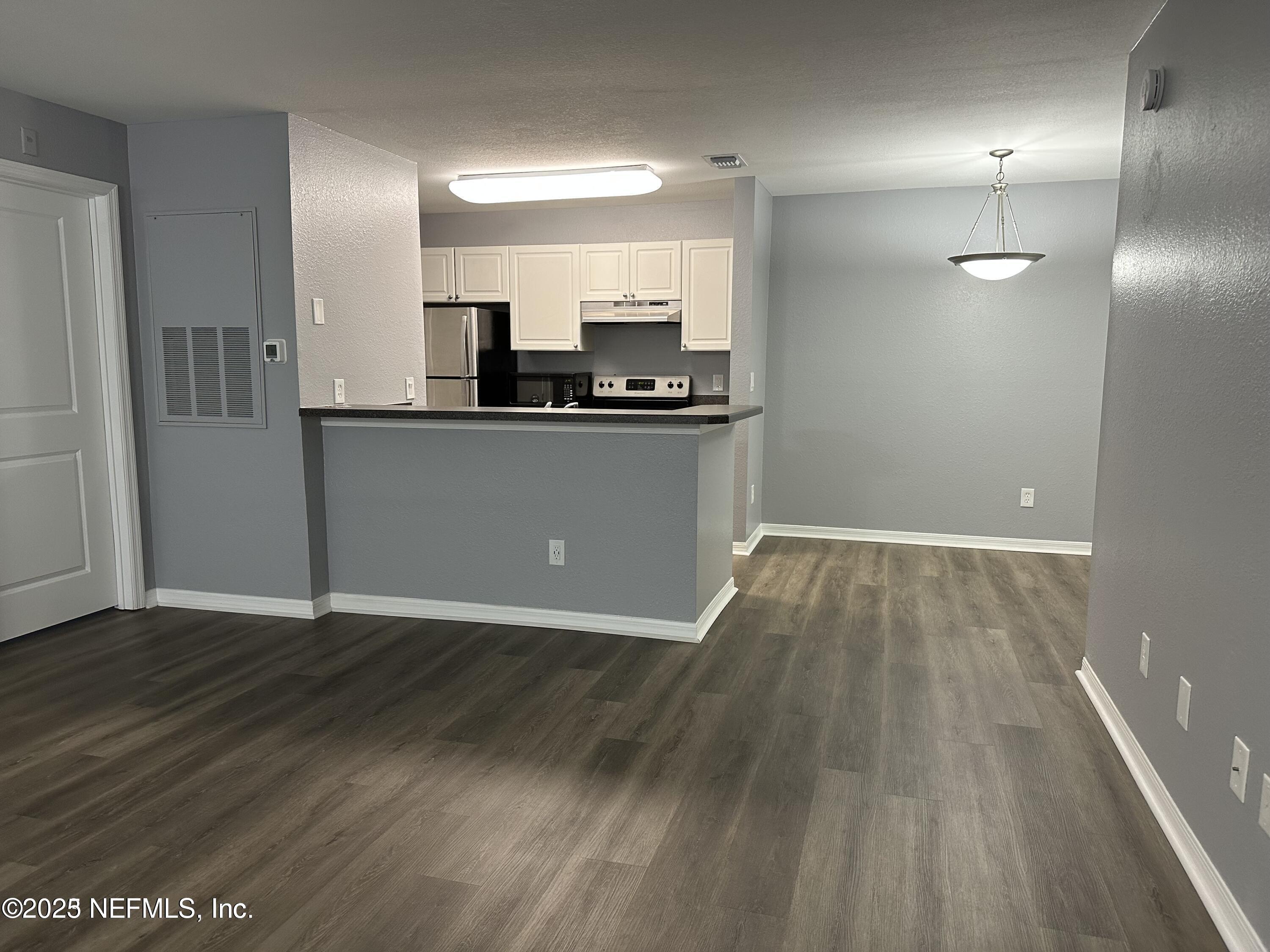 1717 County Road 220, Unit 2102 Fleming Island, FL 32003 - Photo 4 of 10 a view of kitchen with wooden floor