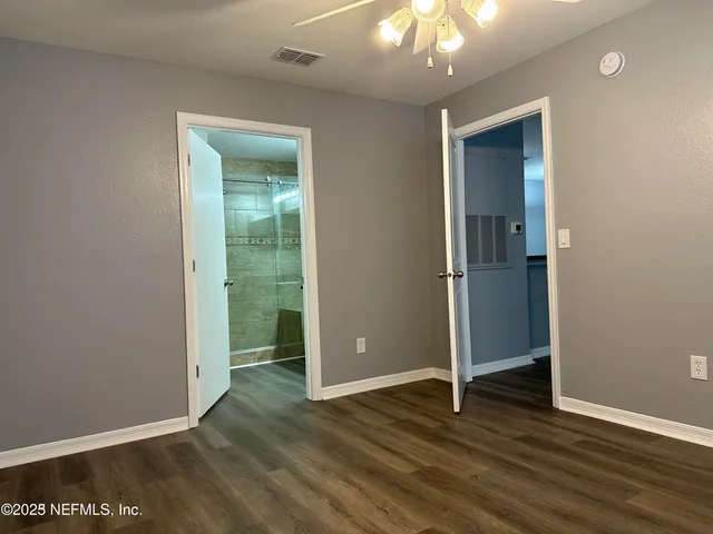 a bathroom with a shower and a sink