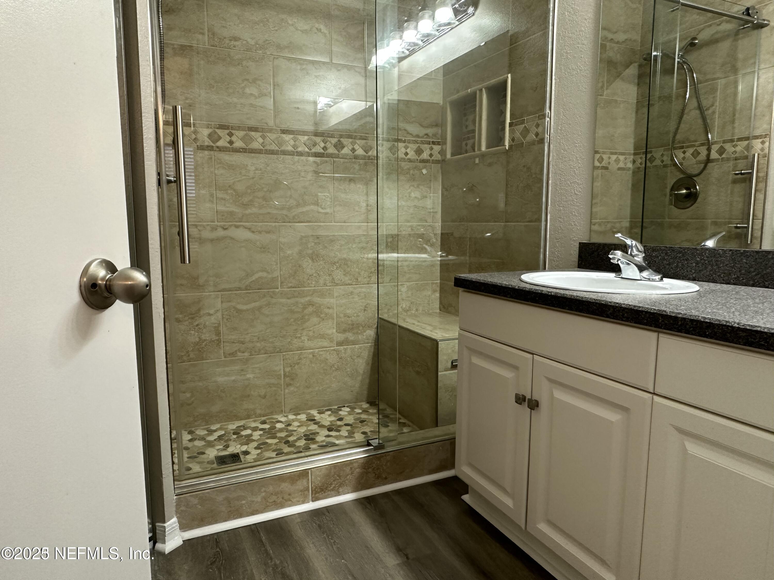 1717 County Road 220, Unit 2102 Fleming Island, FL 32003 - Photo 8 of 10 a bathroom with a shower and a sink