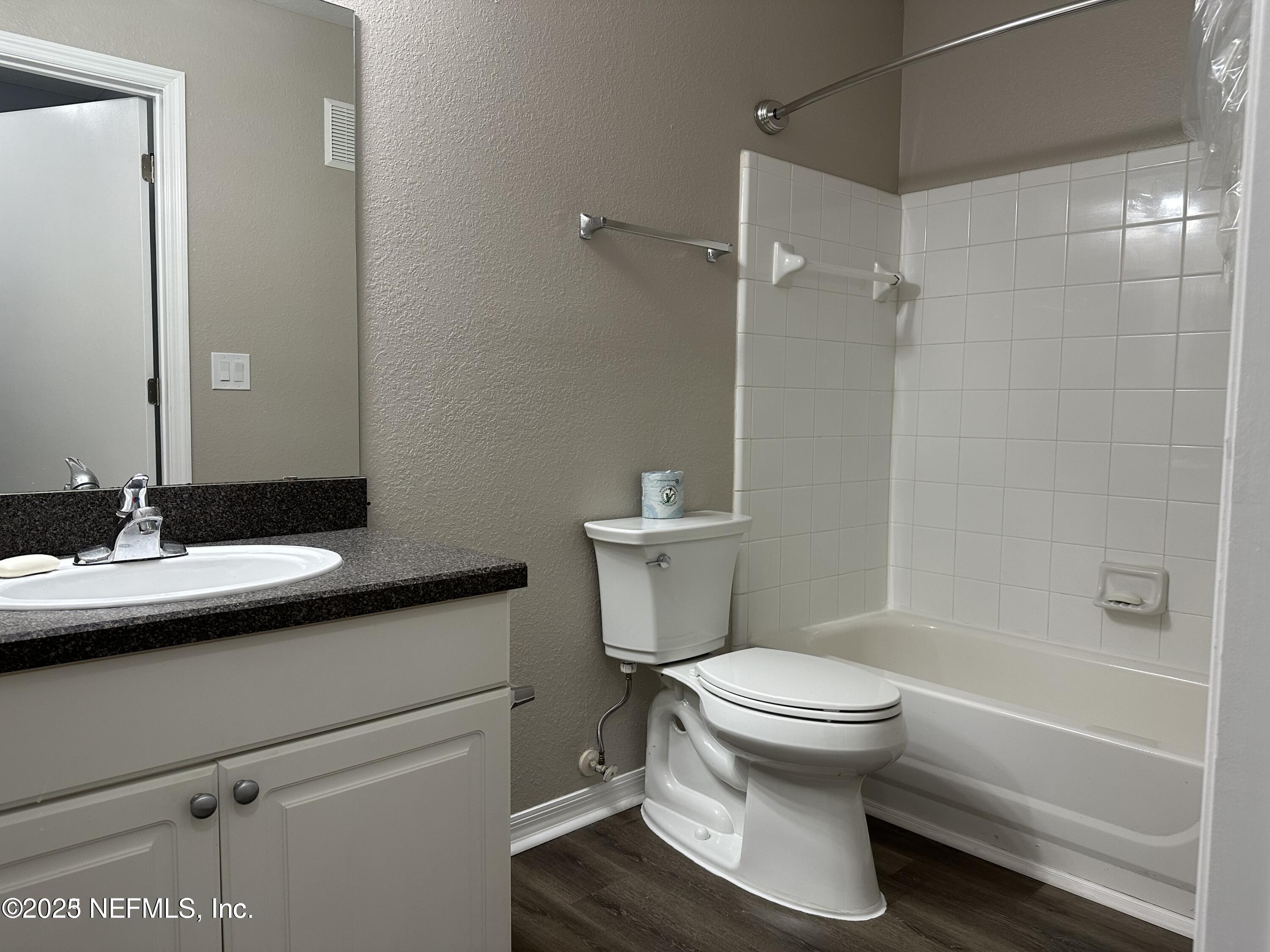 1717 County Road 220, Unit 2102 Fleming Island, FL 32003 - Photo 10 of 10 a bathroom with a sink toilet and shower