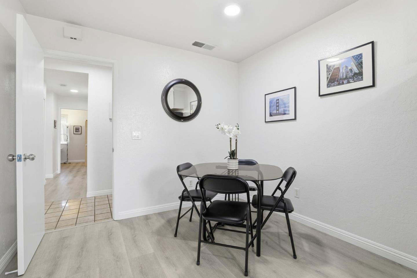 4013 Ralston Common Fremont, CA 94538 - Photo 15 of 40 a view of a dining room with furniture and wooden floor
