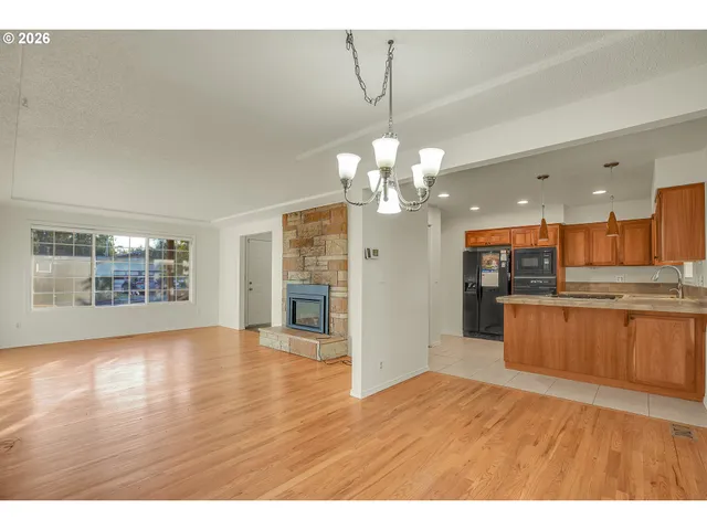 a view of a kitchen with a sink and cabinet