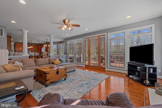784 Olivia Way Pasadena, MD 21122 - Photo 12 of 38 a living room with furniture and a flat screen tv