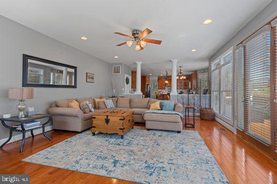 784 Olivia Way Pasadena, MD 21122 - Photo 13 of 38 a living room with furniture or couch and a rug