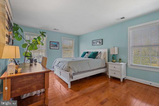 784 Olivia Way Pasadena, MD 21122 - Photo 16 of 38 a bedroom with a bed and a dresser