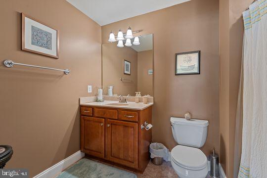 784 Olivia Way Pasadena, MD 21122 - Photo 18 of 38 a bathroom with a toilet a sink and mirror