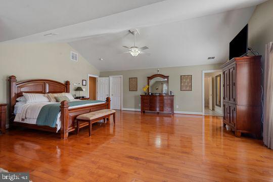 784 Olivia Way Pasadena, MD 21122 - Photo 20 of 38 a bedroom with furniture and a flat screen tv