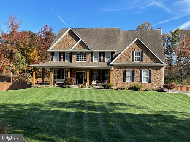 784 Olivia Way Pasadena, MD 21122 - Photo 2 of 38 a front view of a house with a garden