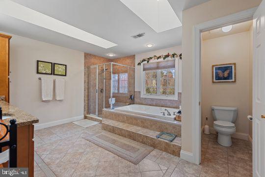 784 Olivia Way Pasadena, MD 21122 - Photo 23 of 38 a spacious bathroom with a tub shower and toilet