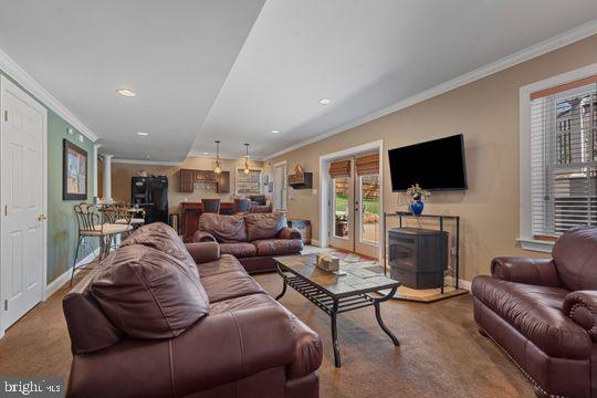 784 Olivia Way Pasadena, MD 21122 - Photo 26 of 38 a living room with furniture and a flat screen tv