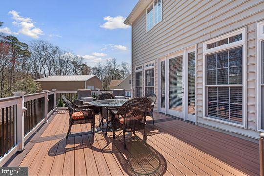 784 Olivia Way Pasadena, MD 21122 - Photo 35 of 38 a view of a patio with a table and chairs