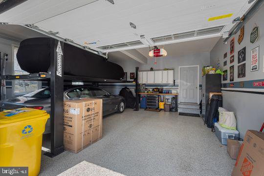 784 Olivia Way Pasadena, MD 21122 - Photo 36 of 38 a view of a storage & utility room with stuff fridge and stairs