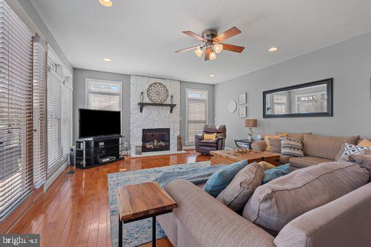 784 Olivia Way Pasadena, MD 21122 - Photo 7 of 38 a living room with furniture fireplace and a flat screen tv