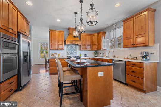 784 Olivia Way Pasadena, MD 21122 - Photo 8 of 38 a kitchen with stainless steel appliances granite countertop a stove a sink a refrigerator and a refrigerator