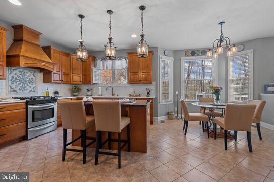 784 Olivia Way Pasadena, MD 21122 - Photo 9 of 38 a dining room with furniture a chandelier and kitchen view