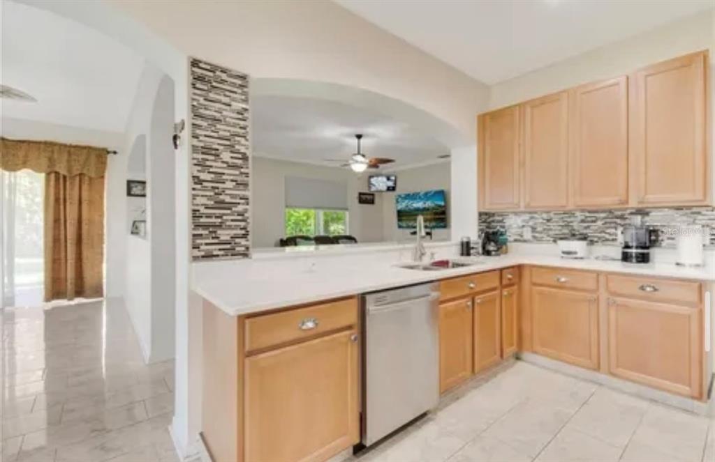13315 Daffodil Way Astatula, FL 34705 - Photo 11 of 29 a kitchen with a sink and cabinets