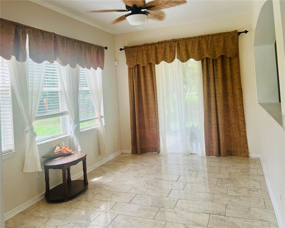 13315 Daffodil Way Astatula, FL 34705 - Photo 13 of 29 a view of a room with window and furniture