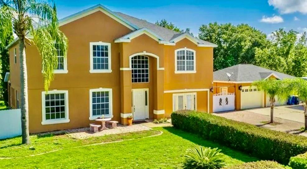 13315 Daffodil Way Astatula, FL 34705 - Photo 2 of 29 front view of house with a yard