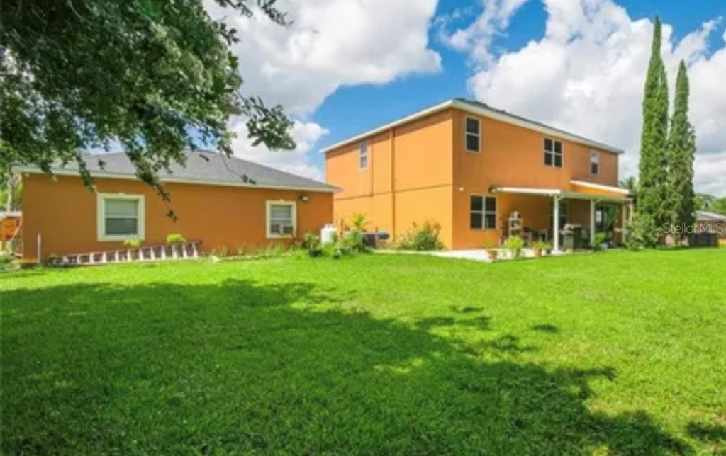 13315 Daffodil Way Astatula, FL 34705 - Photo 3 of 29 a view of a house with a backyard