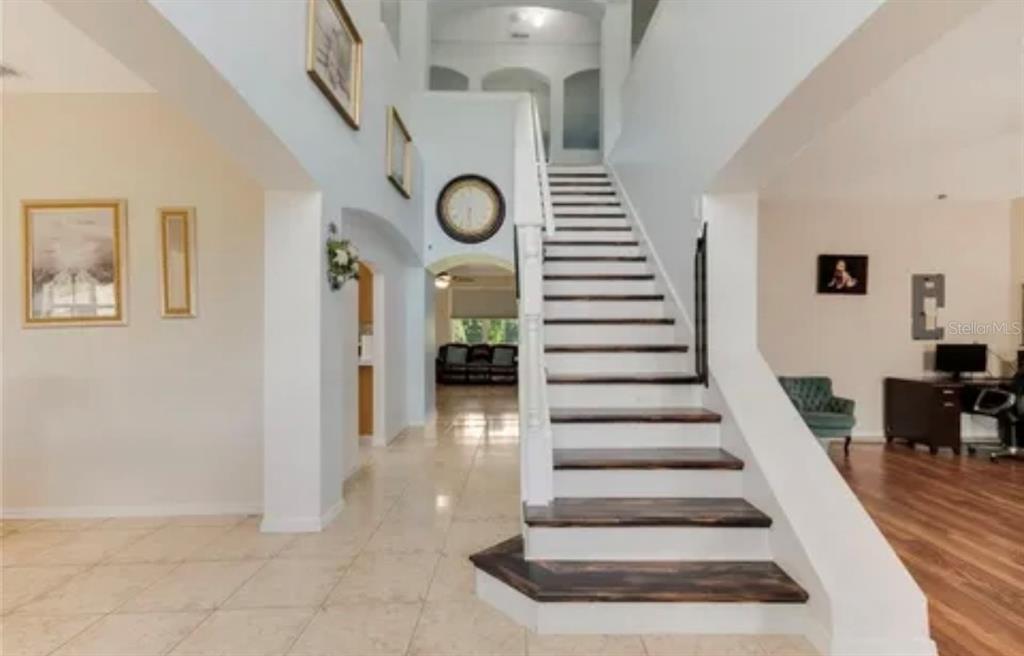 13315 Daffodil Way Astatula, FL 34705 - Photo 5 of 29 a view of entryway and hall with wooden floor