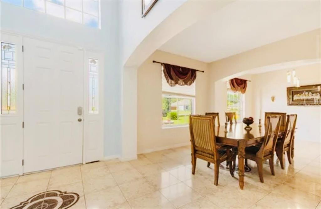 13315 Daffodil Way Astatula, FL 34705 - Photo 6 of 29 a view of a dining room with furniture