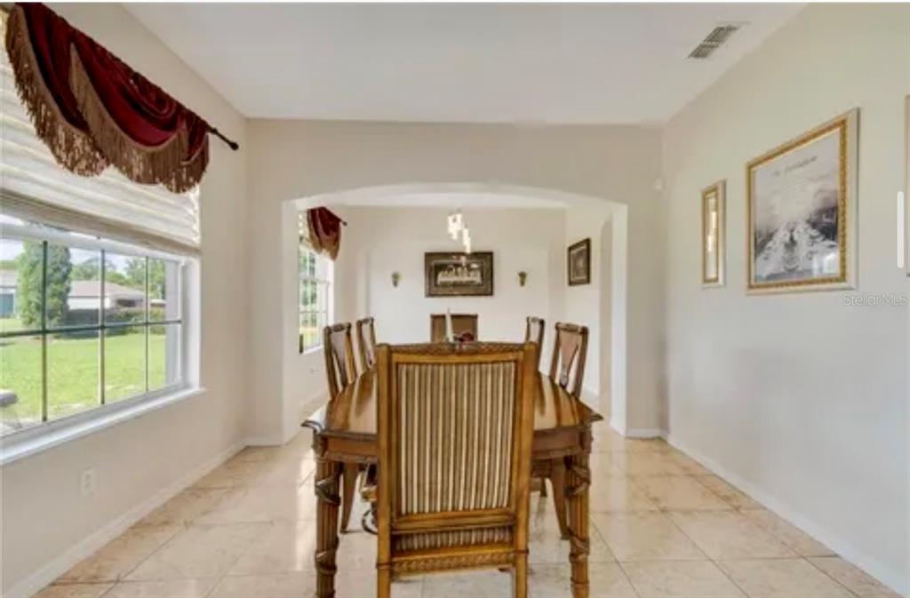 13315 Daffodil Way Astatula, FL 34705 - Photo 7 of 29 a view of a hallway with workspace