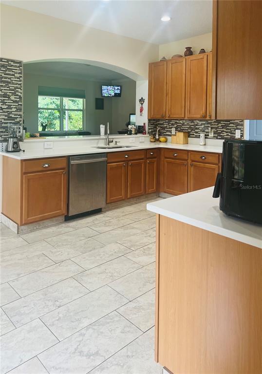 13315 Daffodil Way Astatula, FL 34705 - Photo 10 of 29 a large kitchen with a sink and cabinets