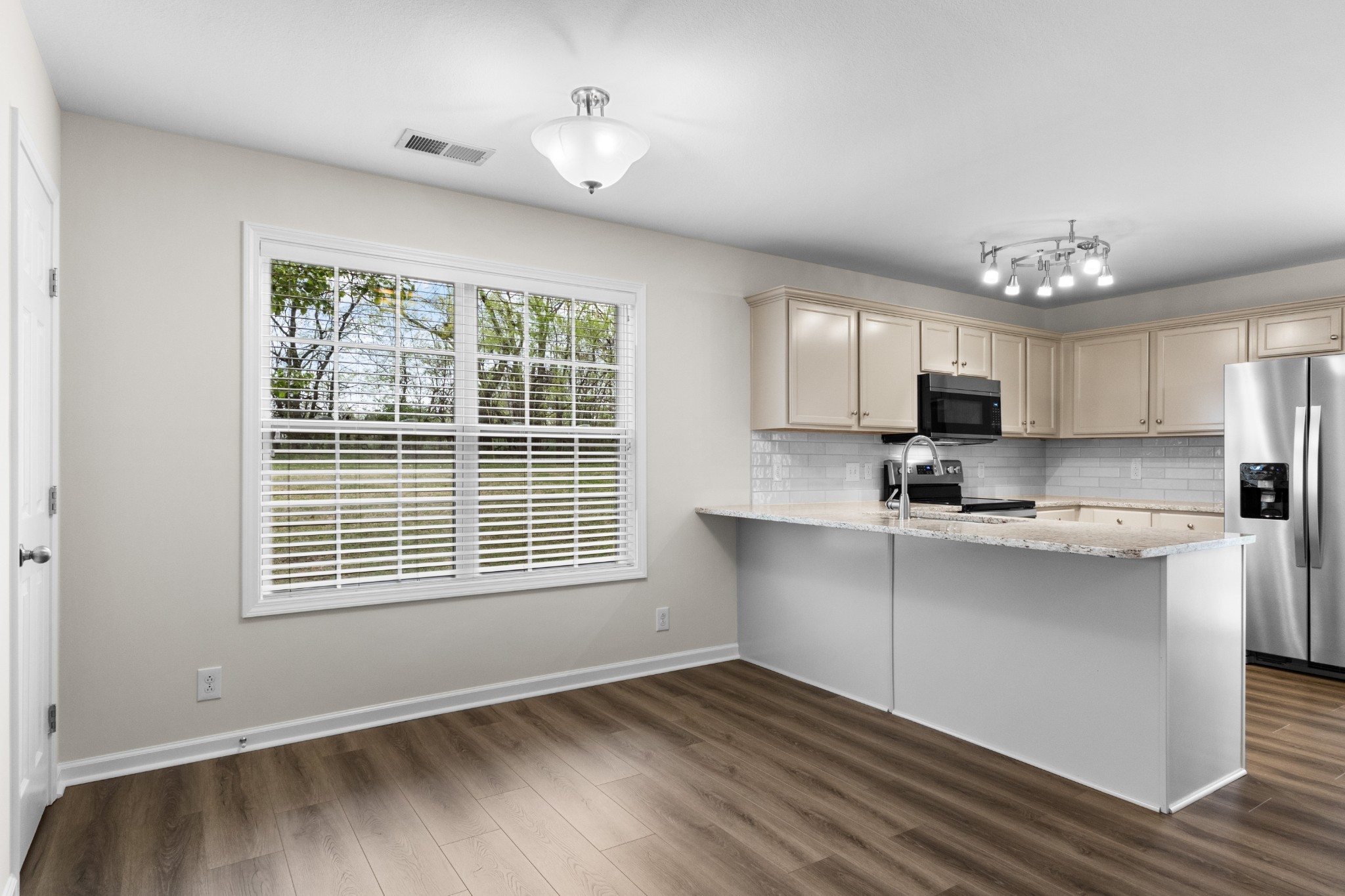 179 Alexander Boulevard Clarksville, TN 37040 - Photo 12 of 40 a view of kitchen with wooden floor and electronic appliances