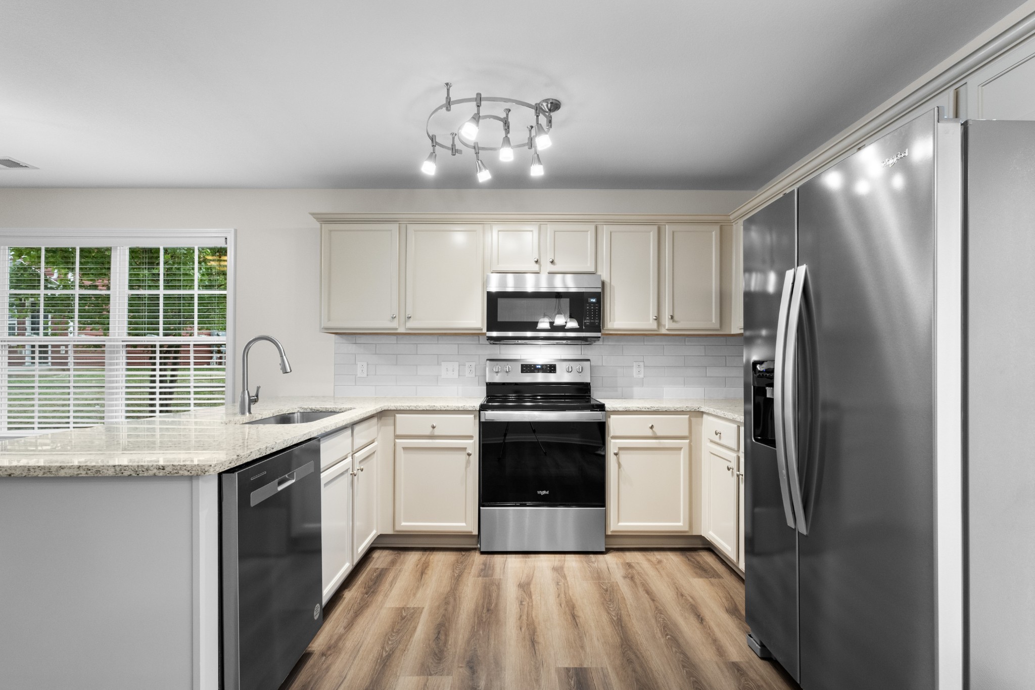 179 Alexander Boulevard Clarksville, TN 37040 - Photo 13 of 40 a kitchen with stainless steel appliances granite countertop a sink stove and refrigerator