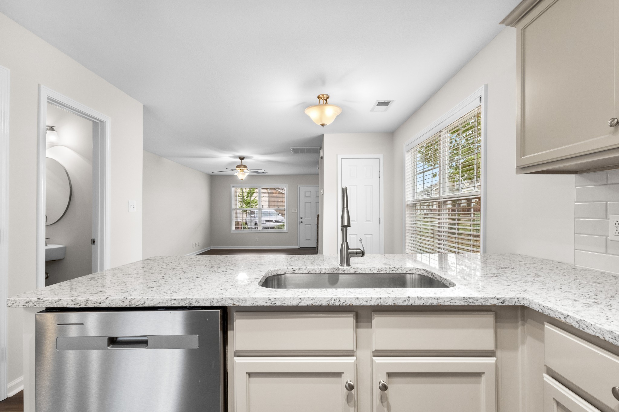 179 Alexander Boulevard Clarksville, TN 37040 - Photo 17 of 40 a kitchen with granite countertop a sink and a wooden floor