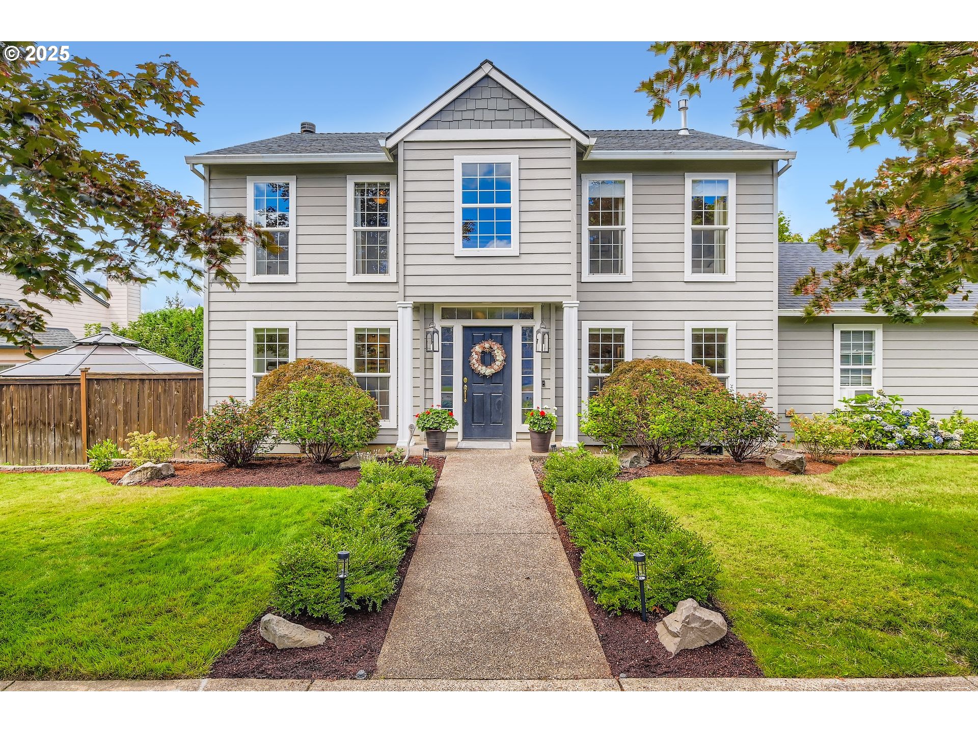 a front view of a house with a yard