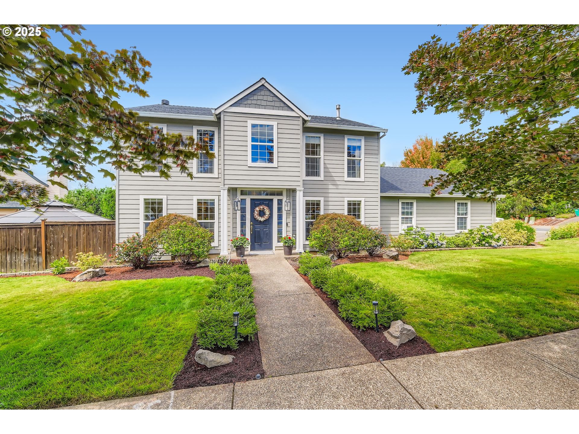 716 Roxe Drive Forest Grove, OR 97116 - Photo 2 of 37 a front view of a house with a yard
