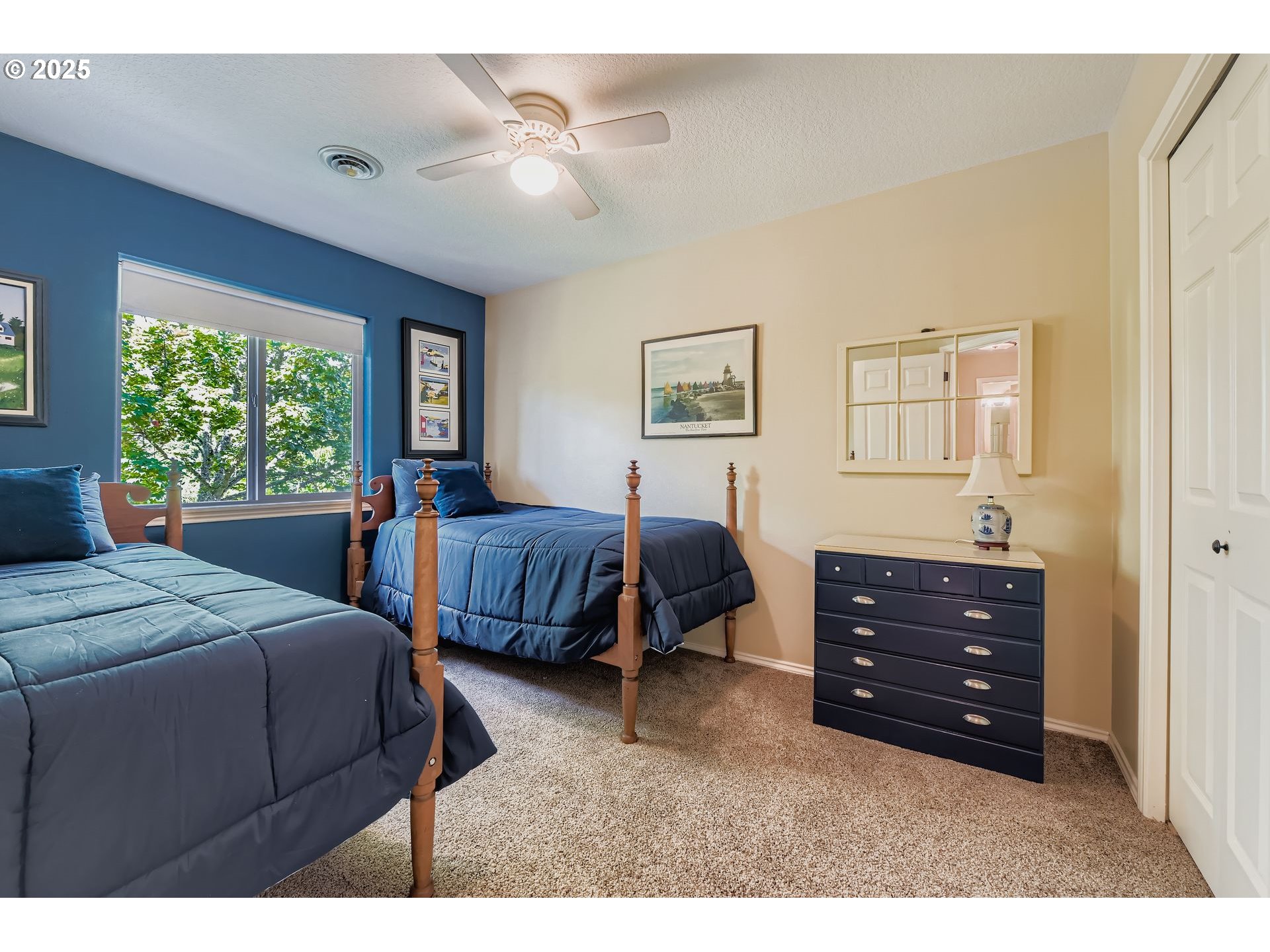 716 Roxe Drive Forest Grove, OR 97116 - Photo 21 of 37 a bedroom with a bed a chandelier and a dresser