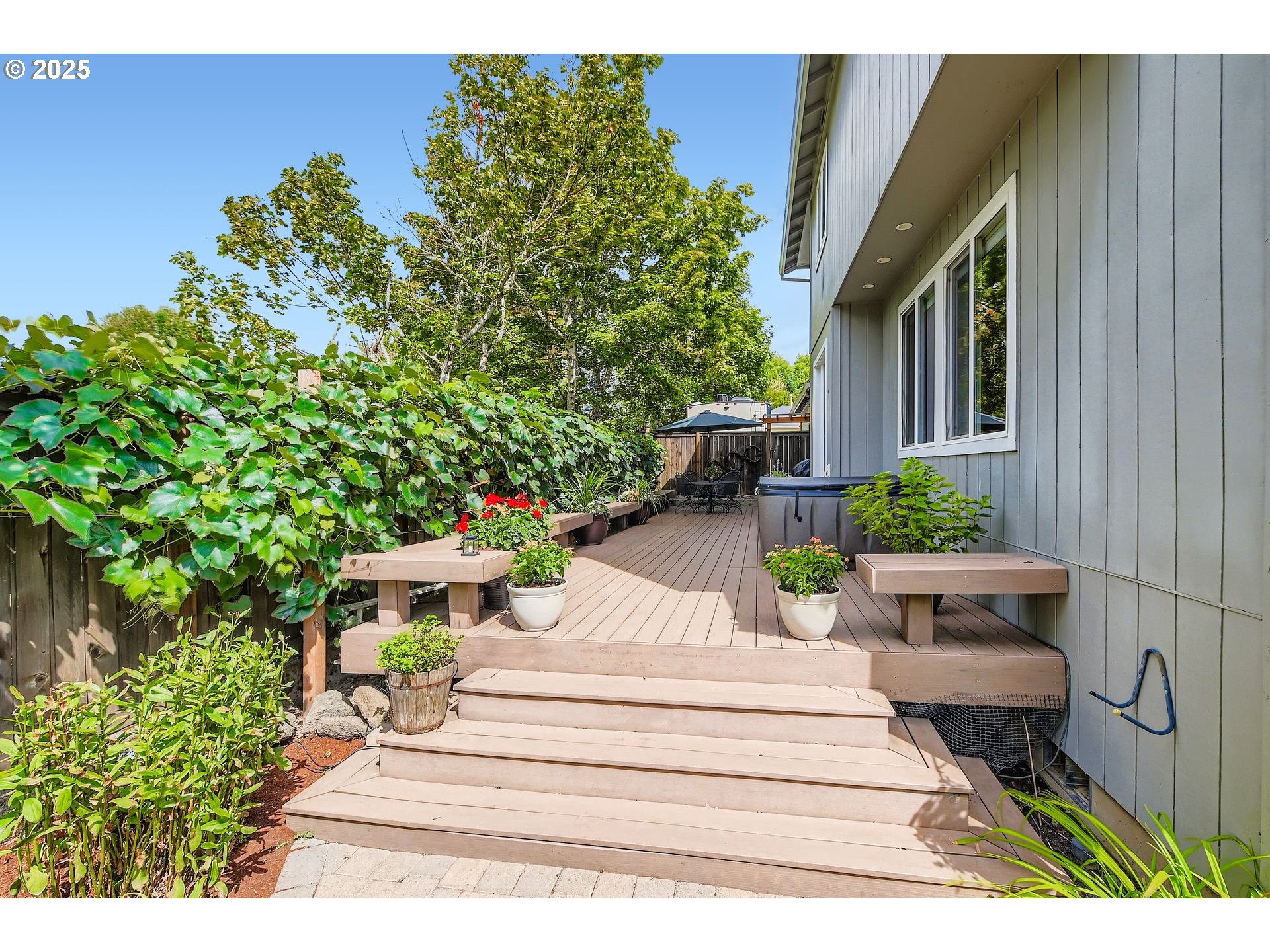 716 Roxe Drive Forest Grove, OR 97116 - Photo 26 of 37 a view of a backyard with chair and potted plants