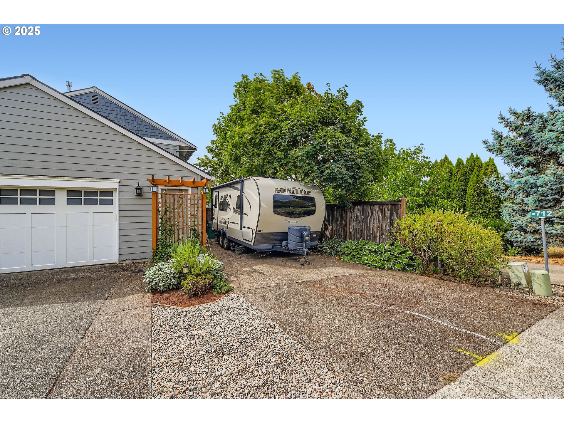 716 Roxe Drive Forest Grove, OR 97116 - Photo 34 of 37 a backyard of a house with table and chairs plants and large tree