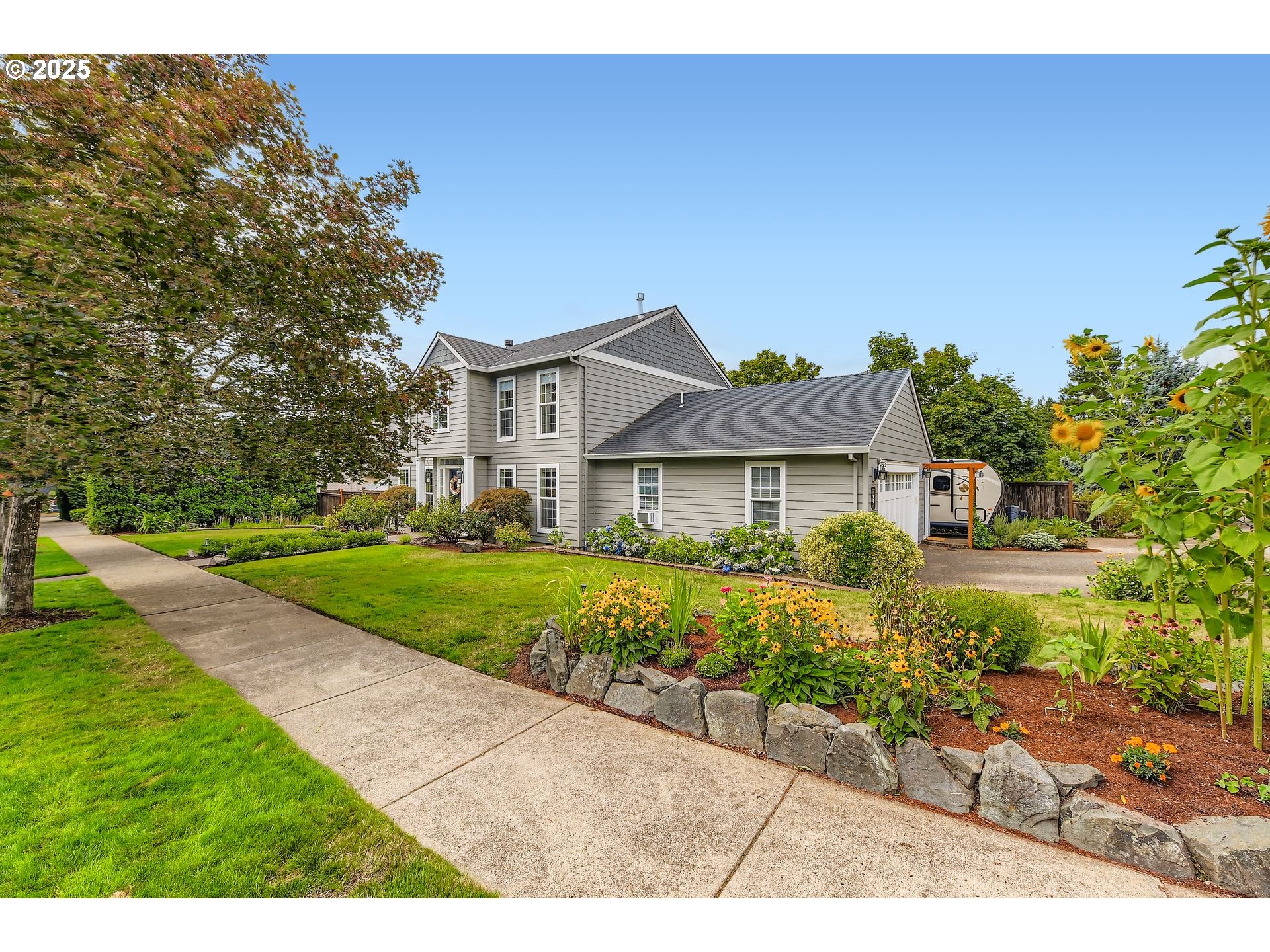 716 Roxe Drive Forest Grove, OR 97116 - Photo 4 of 37 a front view of a house with a yard