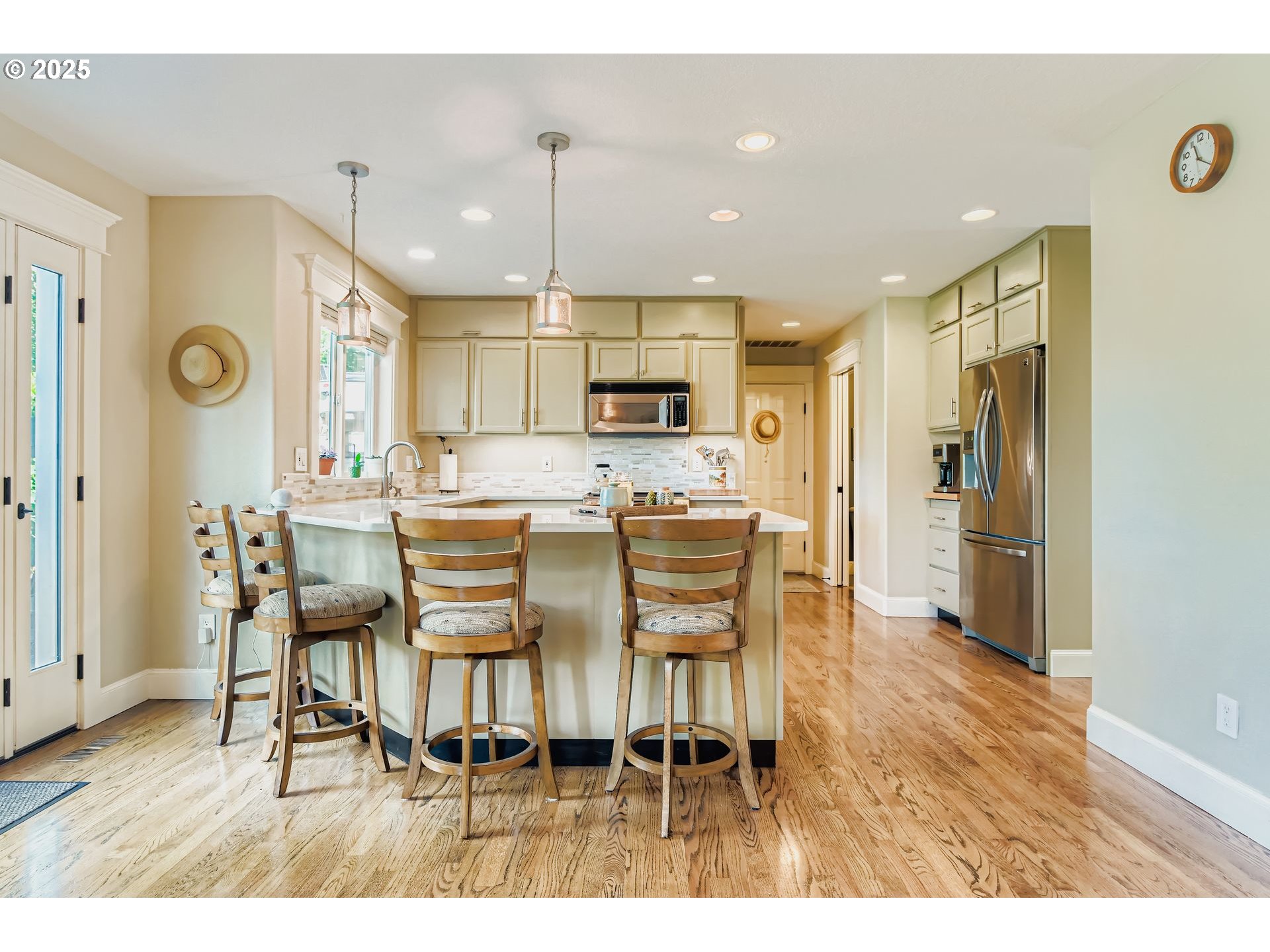 716 Roxe Drive Forest Grove, OR 97116 - Photo 8 of 37 a dining room with stainless steel appliances kitchen island granite countertop a dining table chairs and a refrigerator
