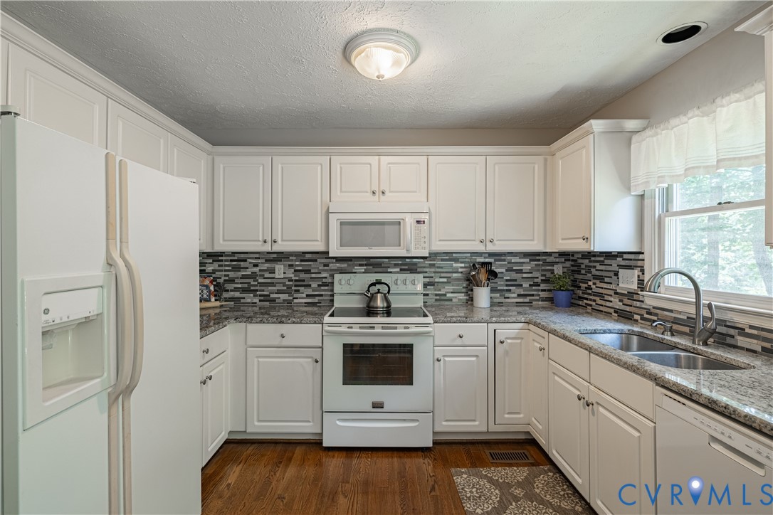 4501 Foxwood Road Chester, VA 23831 - Photo 11 of 42 Kitchen featuring white cabinetry, granite-finish
