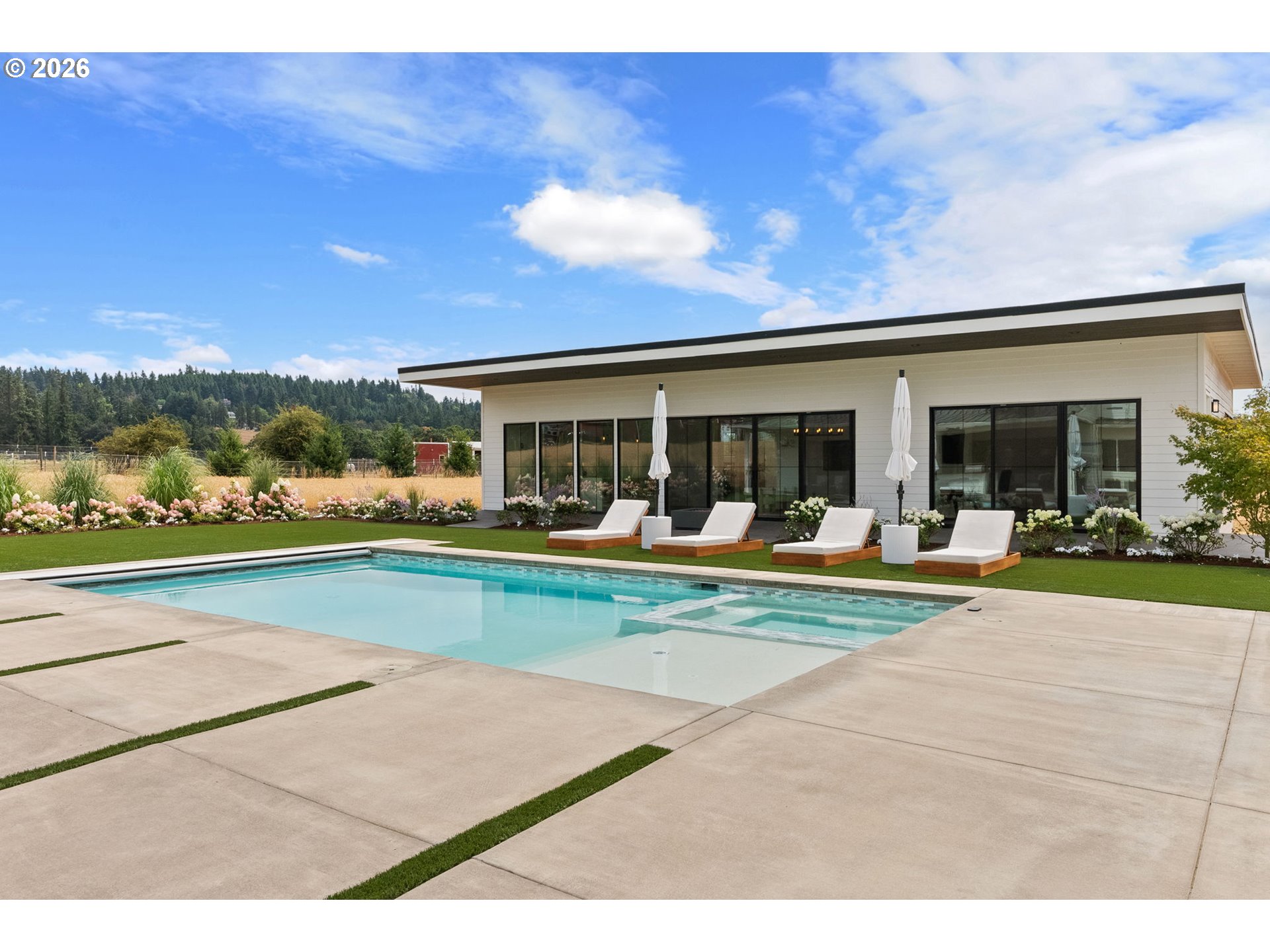 22280 Southwest Stafford Road Tualatin, OR 97062 - Photo 40 of 48 a view of swimming pool with outdoor seating and a garden