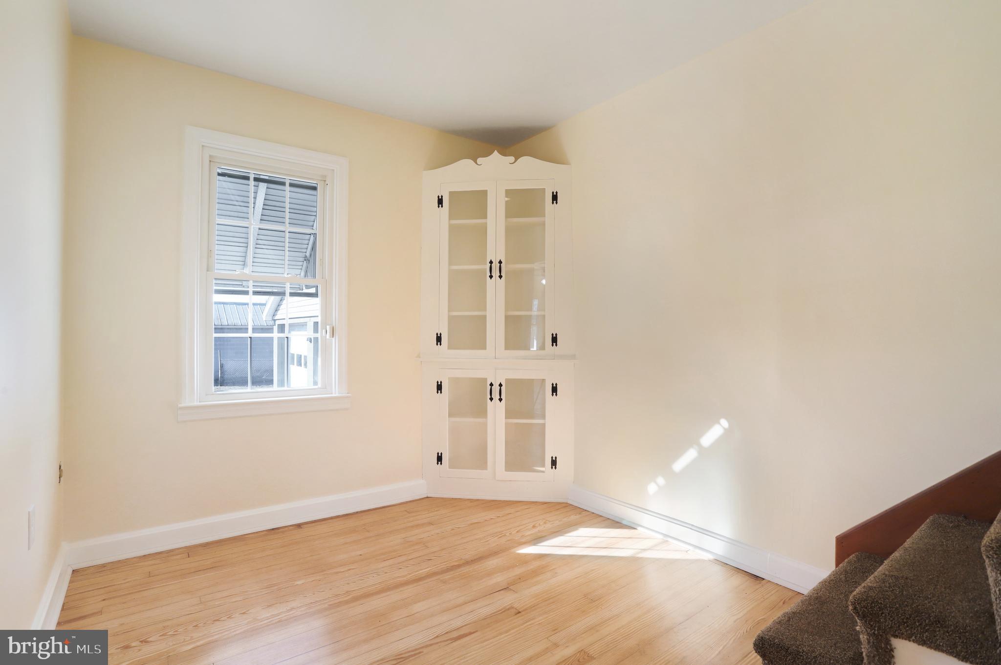 12112 Walnut Point Road Hagerstown, MD 21740 - Photo 13 of 34 Separate dining room w/ hardwood flooring.