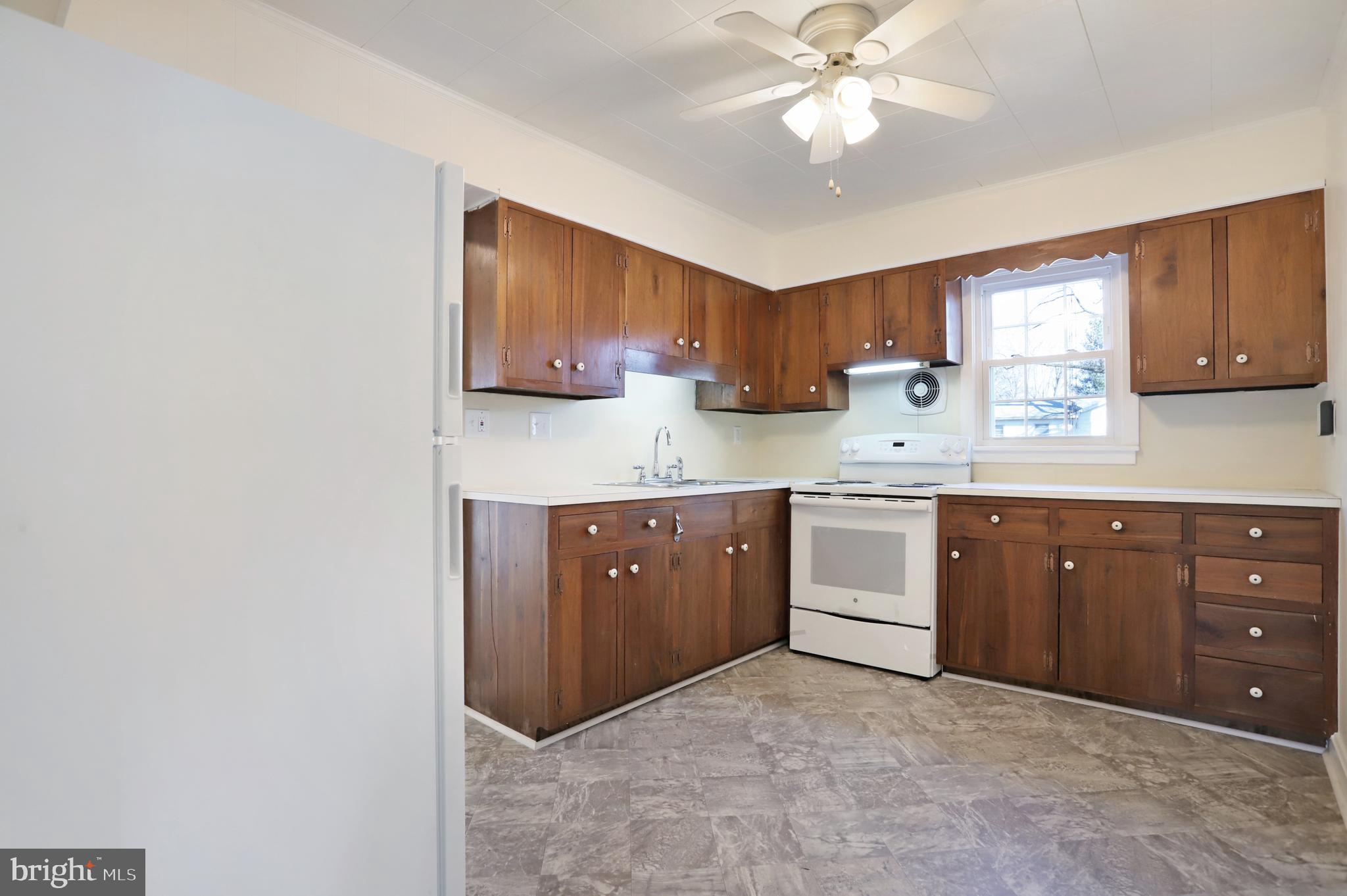 12112 Walnut Point Road Hagerstown, MD 21740 - Photo 15 of 34 Kitchen - New vinyl flooring and new appliances.