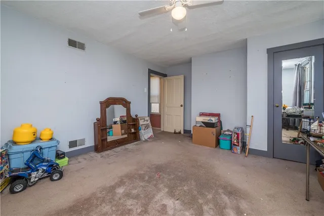 a view of a room with furniture and toys