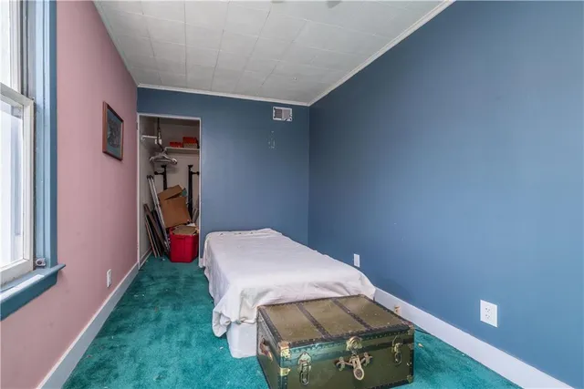 a room with a bed and a window